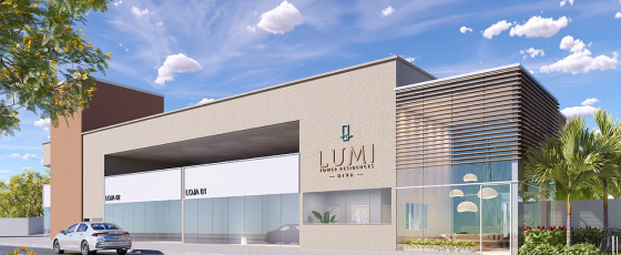 Fachada principal com duas lojas e a entrada para portaria